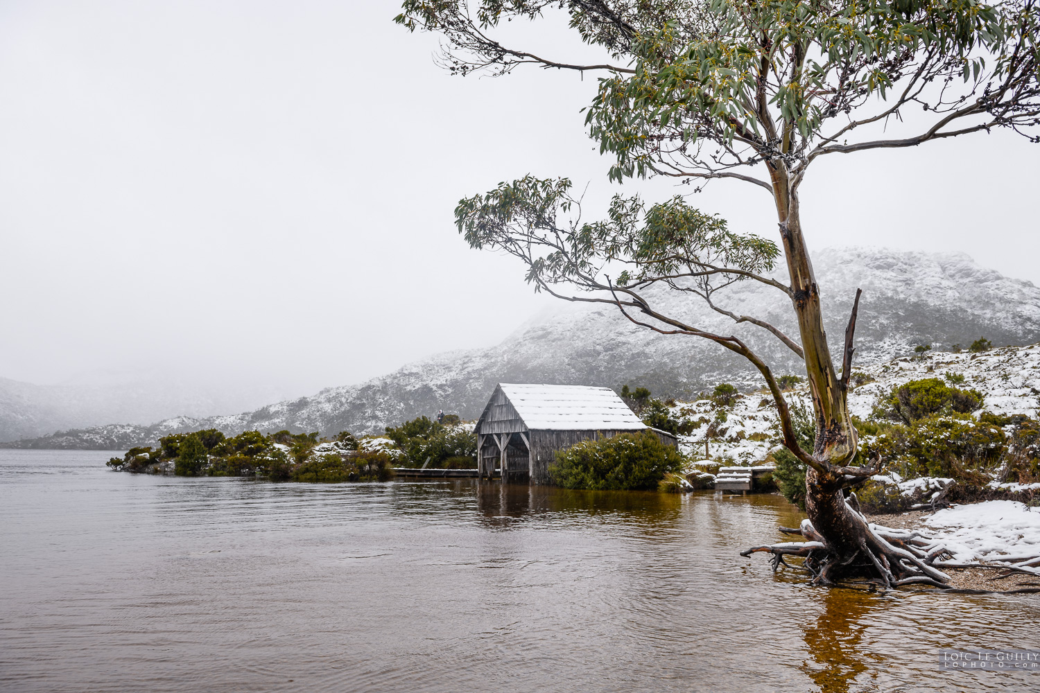 photograph of Dove Lake boat shed under snow